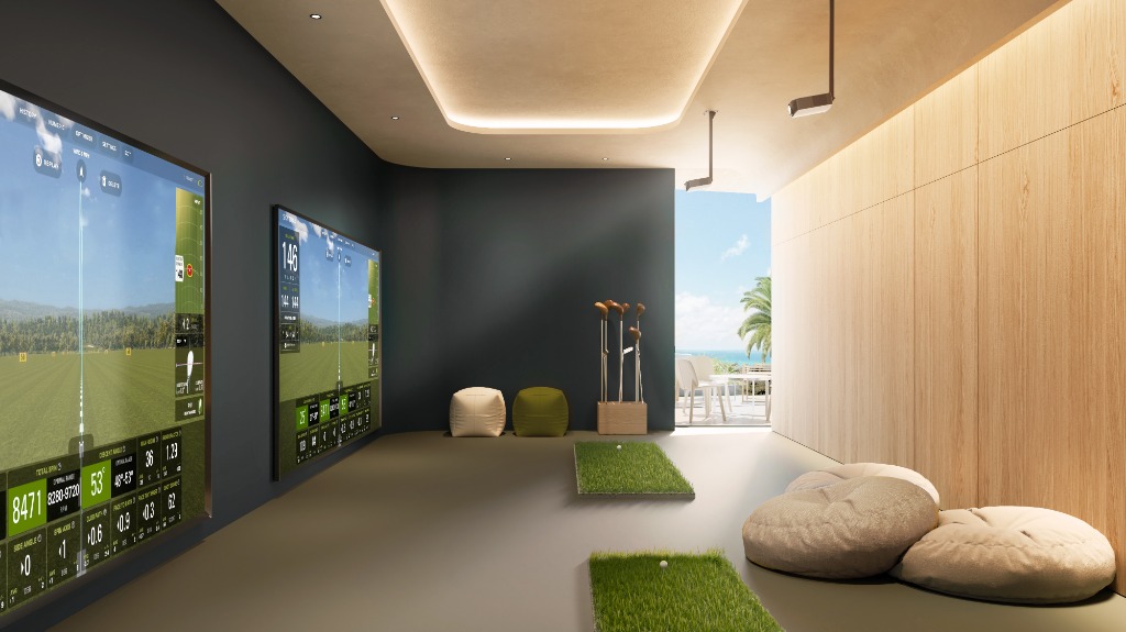 Simulador de golf profesional en The Gem con pantalla de proyección, área de swing y tecnología de análisis
